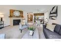 Bright living room featuring a fireplace, open floor plan, and ample natural light at 4648 Chestnut Ln, Boulder, CO 80301