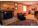 Inviting living room featuring a cozy fireplace, comfortable seating, and stylish decor at 6213 Gray St, Arvada, CO 80003