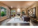Spacious living room features hardwood floors, fireplace, and access to a patio at 820 6Th St, Boulder, CO 80302