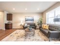 Spacious living room with contemporary furniture and large windows at 821 Robert St, Longmont, CO 80503