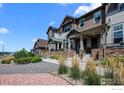 Row of townhouses with stone and siding exterior at 1843 Kalel Ln, Louisville, CO 80027