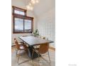 Elegant dining room with a large table and modern chairs at 1891 Ski Hill Rd # 7408, Breckenridge, CO 80424