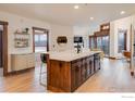 Modern kitchen with an island, dark wood cabinets, and stainless steel appliances at 1891 Ski Hill Rd # 7408, Breckenridge, CO 80424
