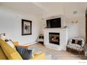 Cozy living room featuring a stone fireplace and comfortable seating at 1891 Ski Hill Rd # 7408, Breckenridge, CO 80424