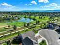 Community overview featuring houses, a golf course, and scenic mountain views at 2074 Medford St, Longmont, CO 80504