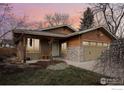 Beautiful home with a covered porch, stone accents and a two-car garage at 2865 Madera Ct, Boulder, CO 80301