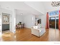 Bright living room with hardwood floors, a small table, and a sofa at 5174 Buckingham Rd, Boulder, CO 80301