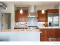 Stylish kitchen with stainless steel appliances and light wood cabinets at 1505 Pearl St # 209, Boulder, CO 80302