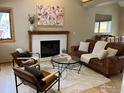 Inviting living room with cozy fireplace, plush seating, and ample natural light at 1620 Oak Ave, Boulder, CO 80304