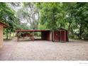 Property features a detached red shed and covered parking area at 1675 Upland Ave, Boulder, CO 80304