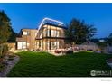 Outdoor oasis with patio furniture and lush lawn at 1860 Bluebell Ave, Boulder, CO 80302
