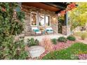 Stone front porch with comfortable seating and landscaping at 4138 Clifton Ct, Boulder, CO 80301