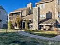 Condo building exterior with walkway and landscaping at 5540 Stonewall Pl # 16, Boulder, CO 80303