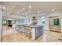 Modern kitchen with large island and stainless steel appliances at 6851 Goldbranch Dr, Niwot, CO 80503