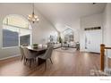 Dining area with hardwood floors and a chandelier at 859 Topaz St, Superior, CO 80027