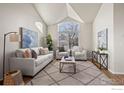 Spacious living room with vaulted ceilings and hardwood floors at 859 Topaz St, Superior, CO 80027