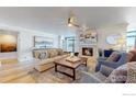 Bright living room featuring hardwood floors and a cozy fireplace at 1777 Larimer St # 1608, Denver, CO 80202