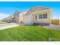 Two story house with front yard and driveway at 2268 Base St, Fort Lupton, CO 80621