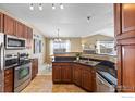 Updated kitchen boasts ample counter space and stainless steel appliances at 3100 Blue Sky Cir # 308, Erie, CO 80516