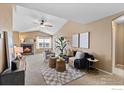 Spacious living room featuring a fireplace and ample natural light at 3100 Blue Sky Cir # 308, Erie, CO 80516