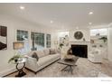 Bright and airy living room featuring a fireplace and built-in shelving at 330 16Th St, Boulder, CO 80302