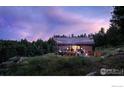 House exterior at dusk with string lights on patio at 3500 Bison Dr, Boulder, CO 80302