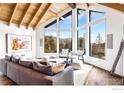 Bright living room with large windows, comfy sofas, and mountain views at 3500 Bison Dr, Boulder, CO 80302