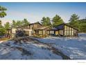 Contemporary mountain home with expansive windows and a large deck at 37 Wagner Cir, Boulder, CO 80304