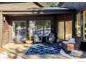 Relaxing patio with comfortable seating and a blue patterned rug at 37 Wagner Cir, Boulder, CO 80304