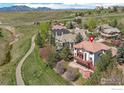 House with red tile roof and deck, near walking path and mountains at 380 Edison Pl, Superior, CO 80027