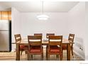 Dining room with wood table and chairs at 6545 Kalua Rd # 203D, Boulder, CO 80301