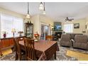 Dining area with a table, chairs, and access to living room and kitchen at 1053 W Century Dr # 102, Louisville, CO 80027
