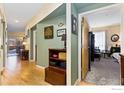 Bright hallway with wood floors and access to other rooms at 1053 W Century Dr # 102, Louisville, CO 80027
