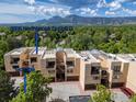 Townhouse complex showcasing individual garages and mountain views at 3805 Northbrook Dr # D, Boulder, CO 80304