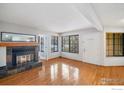 Bright living room with hardwood floors and fireplace, creating a cozy and inviting atmosphere at 4862 E Kentucky Ave # D, Denver, CO 80246