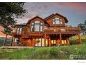 Stunning two-story home with large deck and mountain views at 57 Whispering Pines Rd, Boulder, CO 80302