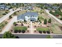 Aerial view of a two-story house with a well-manicured lawn and landscaping at 7664 Weaver Cir, Castle Rock, CO 80104