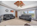 Spacious living room with comfortable seating and large windows at 8260 County Road 39, Fort Lupton, CO 80621