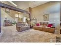 Spacious living room with two sofas and high ceilings at 10517 Taylor Ave, Firestone, CO 80504