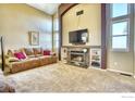 Living room with fireplace and built-in shelving at 10517 Taylor Ave, Firestone, CO 80504