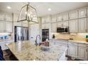 Spacious kitchen featuring granite countertops and stainless steel appliances at 1155 Mcmurdo Cir, Castle Rock, CO 80108