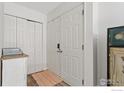 Bright entryway with double doors and a coat closet at 12974 W Virginia Ave, Lakewood, CO 80228