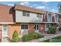 Attractive brick townhome with updated roofing and landscaping at 12974 W Virginia Ave, Lakewood, CO 80228