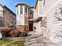 Townhome with bay window and red door at 12988 Grant W Cir # A, Thornton, CO 80241