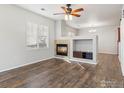 Living room with fireplace and wood-look floors at 12988 Grant W Cir # A, Thornton, CO 80241