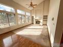 Bright living room with vaulted ceilings, fireplace, and hardwood floors at 1524 E Weldona Way, Superior, CO 80027