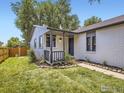 Newly renovated home with fresh landscaping and walkway at 1801 Donovan Dr, Longmont, CO 80501