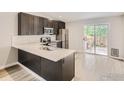 Modern kitchen featuring stainless steel appliances and an island at 1801 Donovan Dr, Longmont, CO 80501