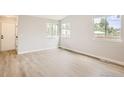 Bright living room with hardwood floors and large windows at 1801 Donovan Dr, Longmont, CO 80501