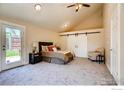 Spacious bedroom with vaulted ceiling, ample natural light, and stylish barn door closet at 2471 Harlan St, Edgewater, CO 80214